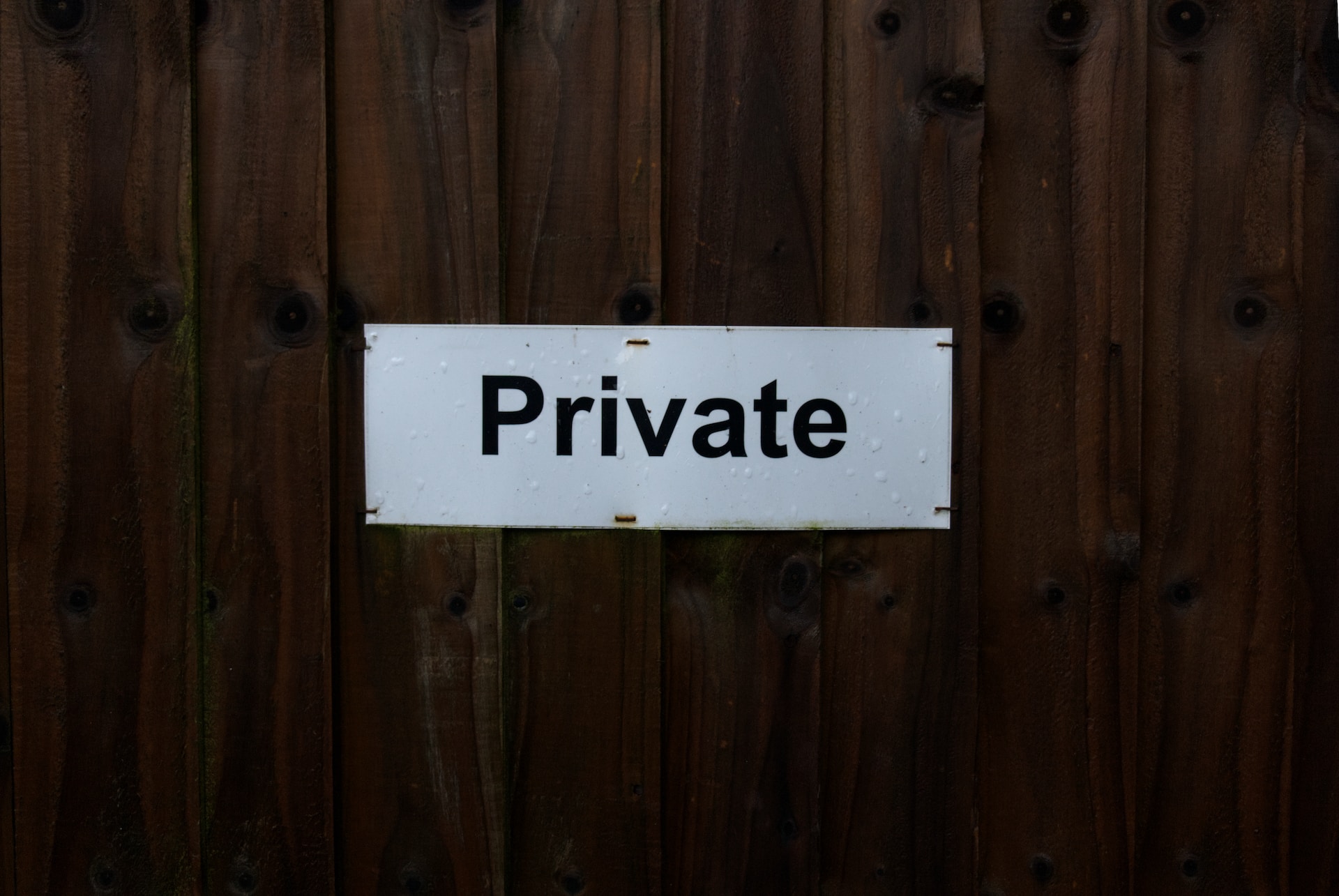 Sign "Private" on a wooden background